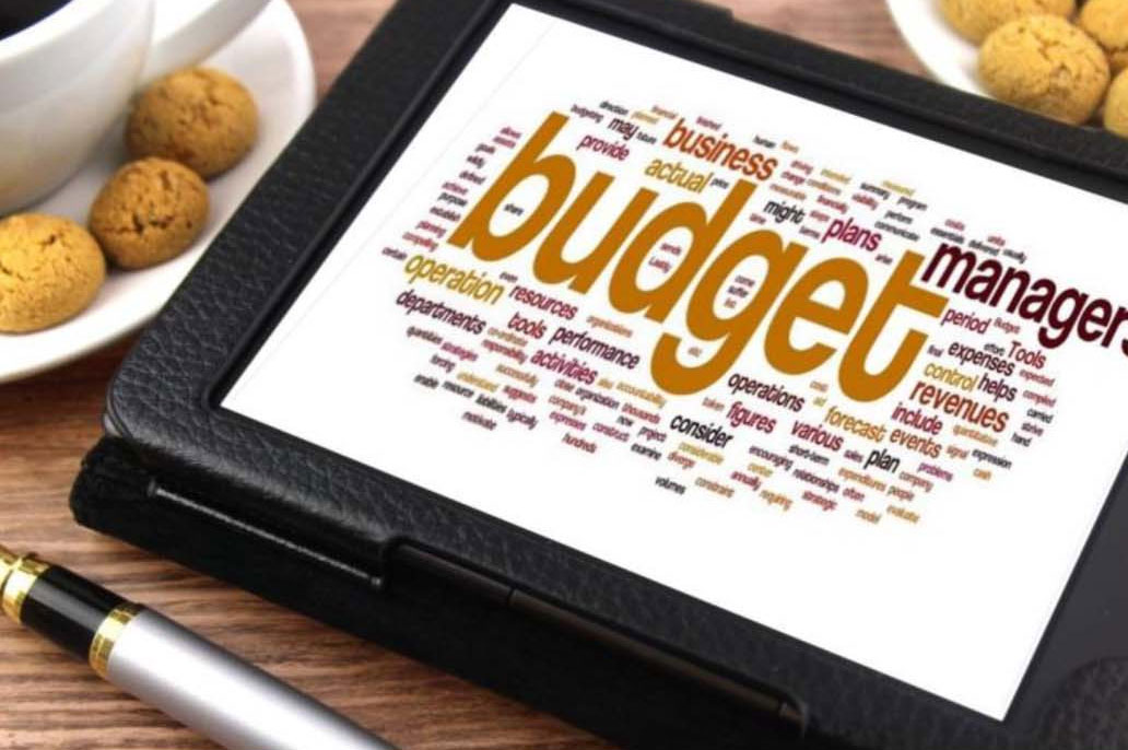 Computer Tablets with Budget Word Cloud - Photo Economics of Being a Woman
